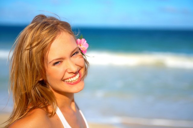 Fashion Shot of a Beautiful Young Woman on the Beach